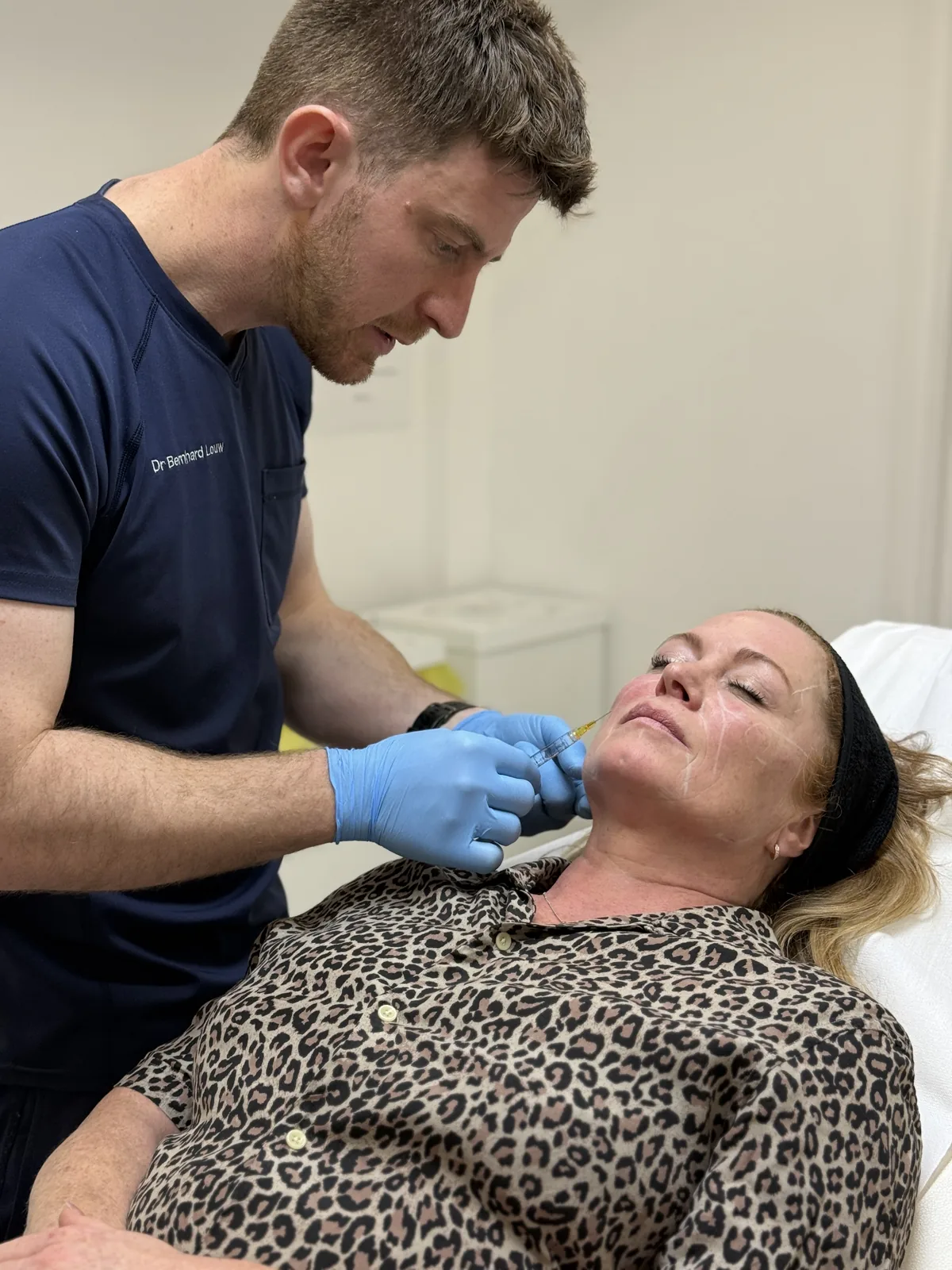 Dr. Bernhard Louw assessing a patient